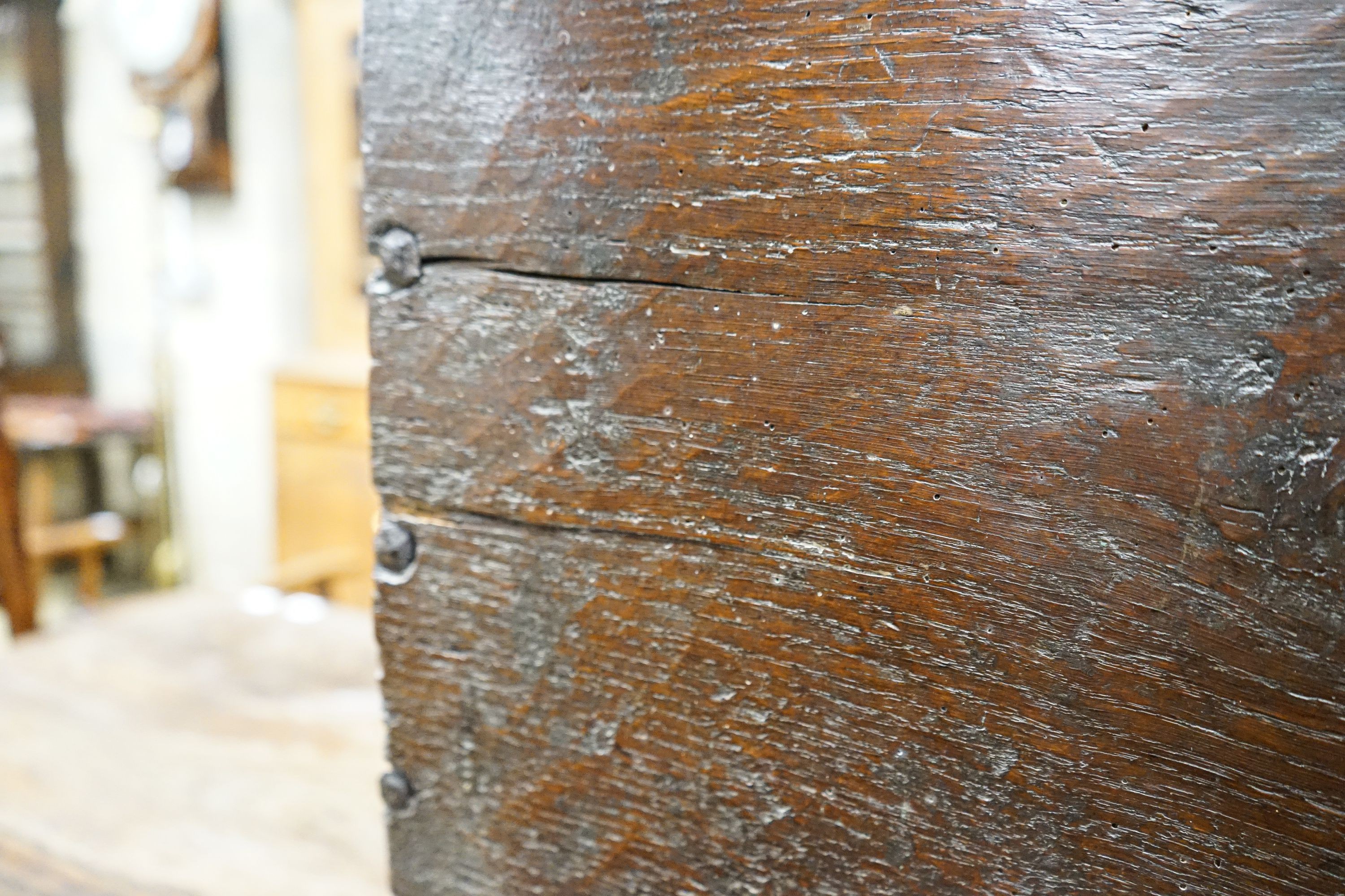 A 17th century oak and elm six plank coffer, width 104cm, depth 36cm, height 54cm